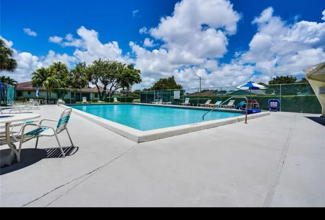 a view of a lake with sitting area