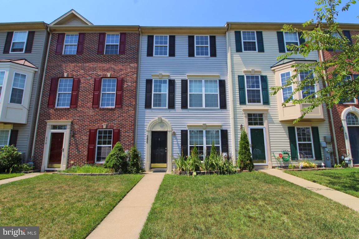 656 Luthardt Road Baltimore, MD 21220 - Photo 1 of 27 a view of a brick building next to a yard
