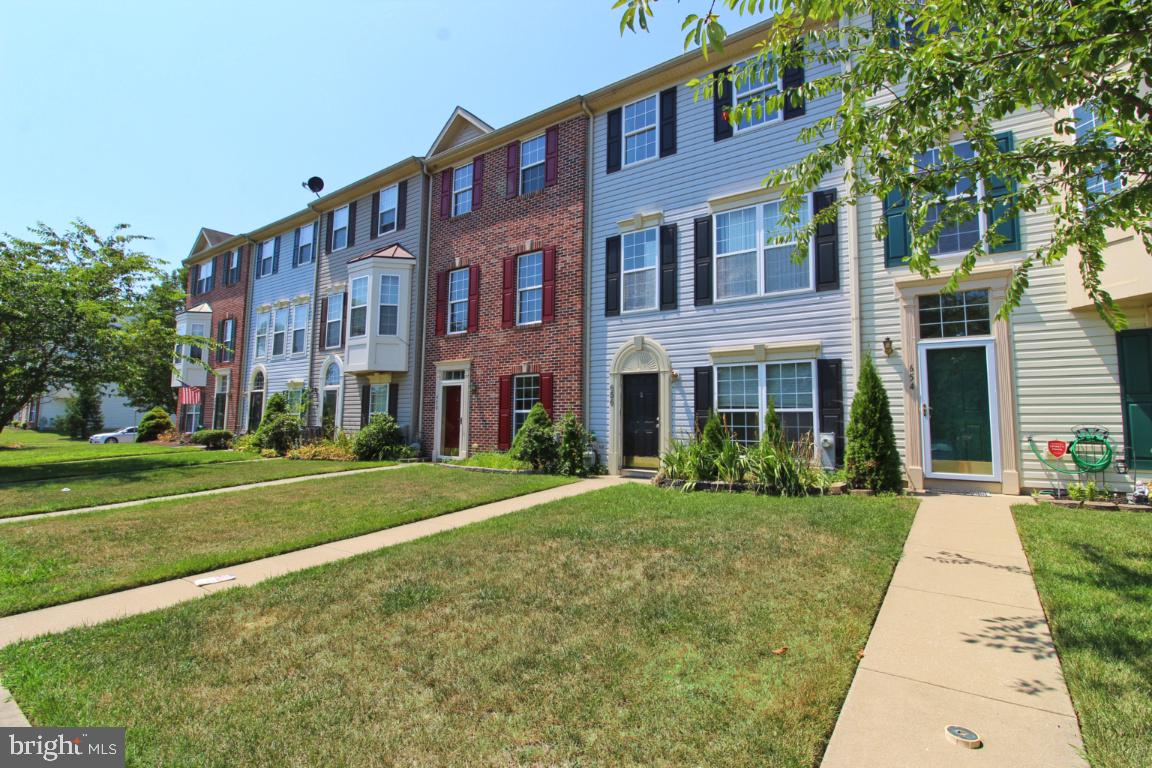 656 Luthardt Road Baltimore, MD 21220 - Photo 2 of 27 a view of a brick building next to a yard