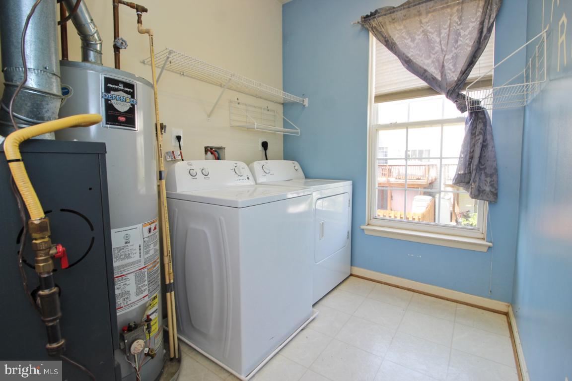 656 Luthardt Road Baltimore, MD 21220 - Photo 16 of 27 a utility room with dryer and washer
