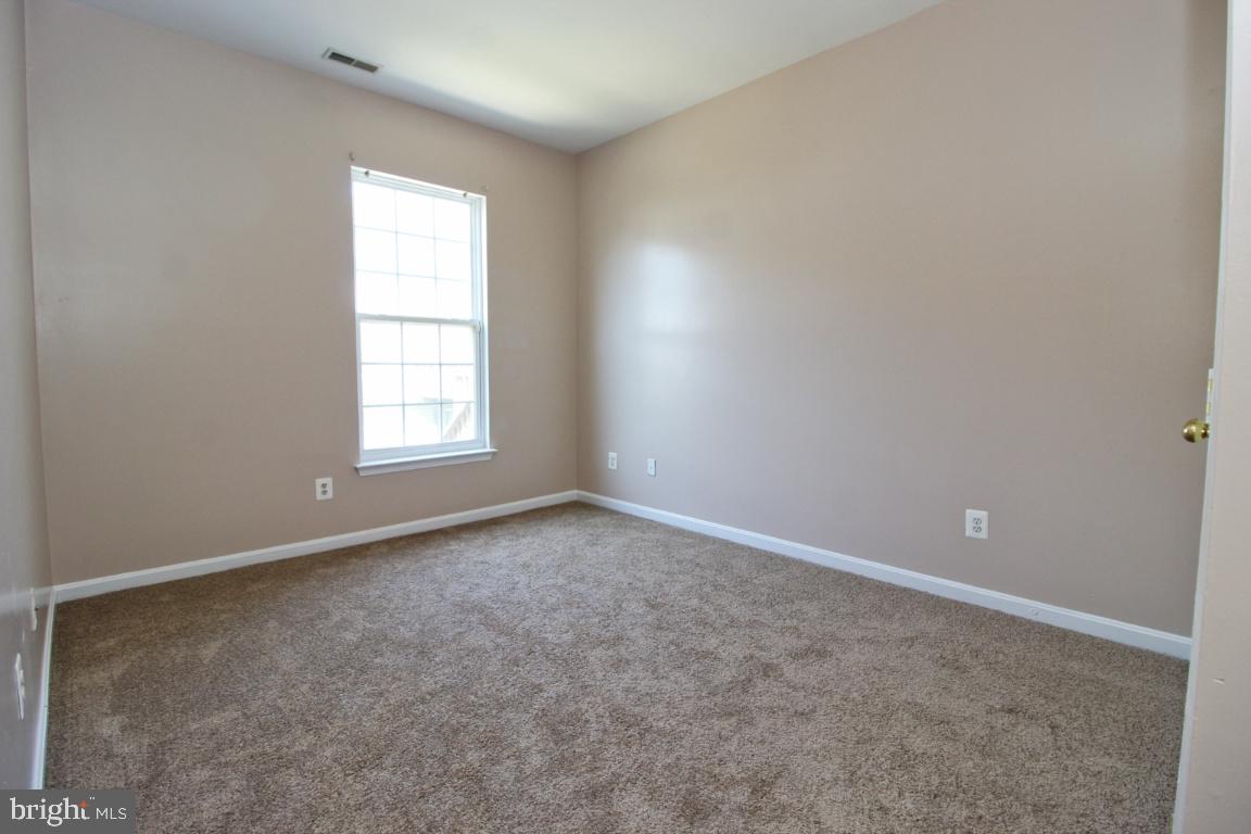 656 Luthardt Road Baltimore, MD 21220 - Photo 18 of 27 an empty room with windows
