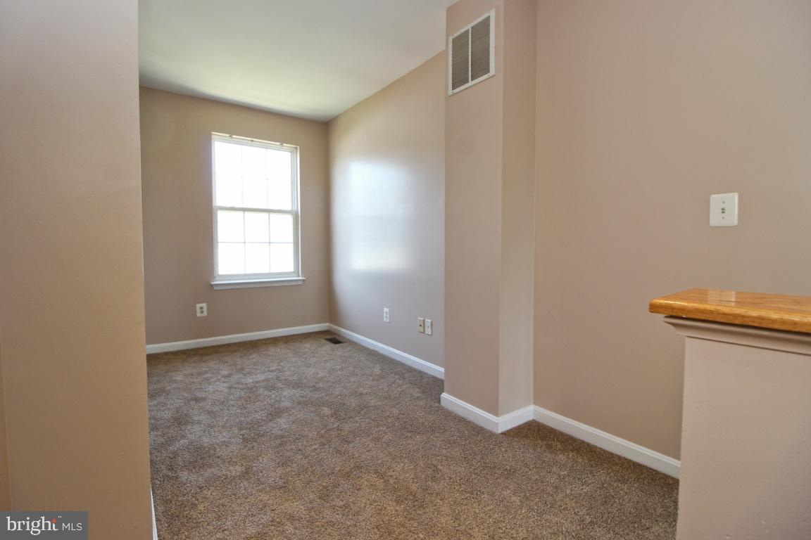 656 Luthardt Road Baltimore, MD 21220 - Photo 22 of 27 an empty room with windows