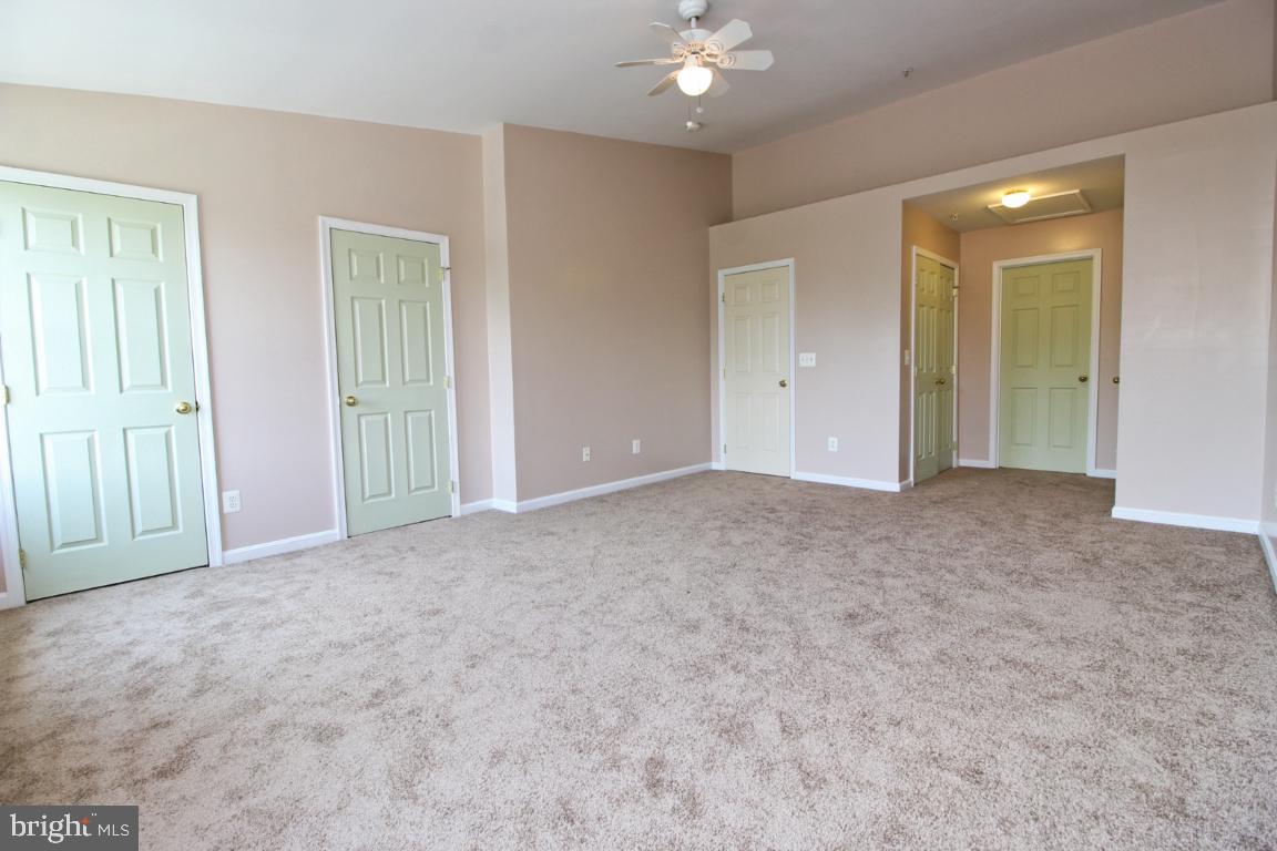 656 Luthardt Road Baltimore, MD 21220 - Photo 23 of 27 a view of an empty room with chandelier fan