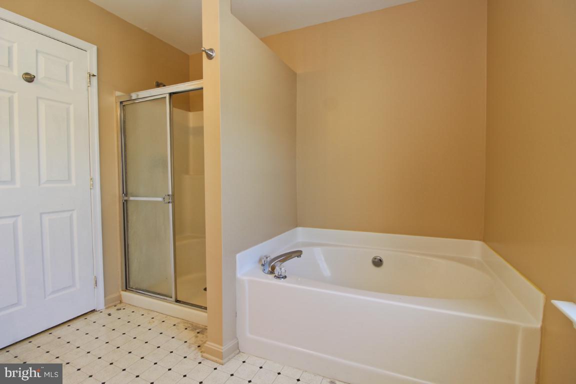 656 Luthardt Road Baltimore, MD 21220 - Photo 26 of 27 a white bath tub sitting in a bathroom