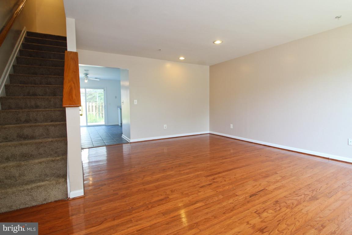 656 Luthardt Road Baltimore, MD 21220 - Photo 6 of 27 a view of empty room with wooden floor