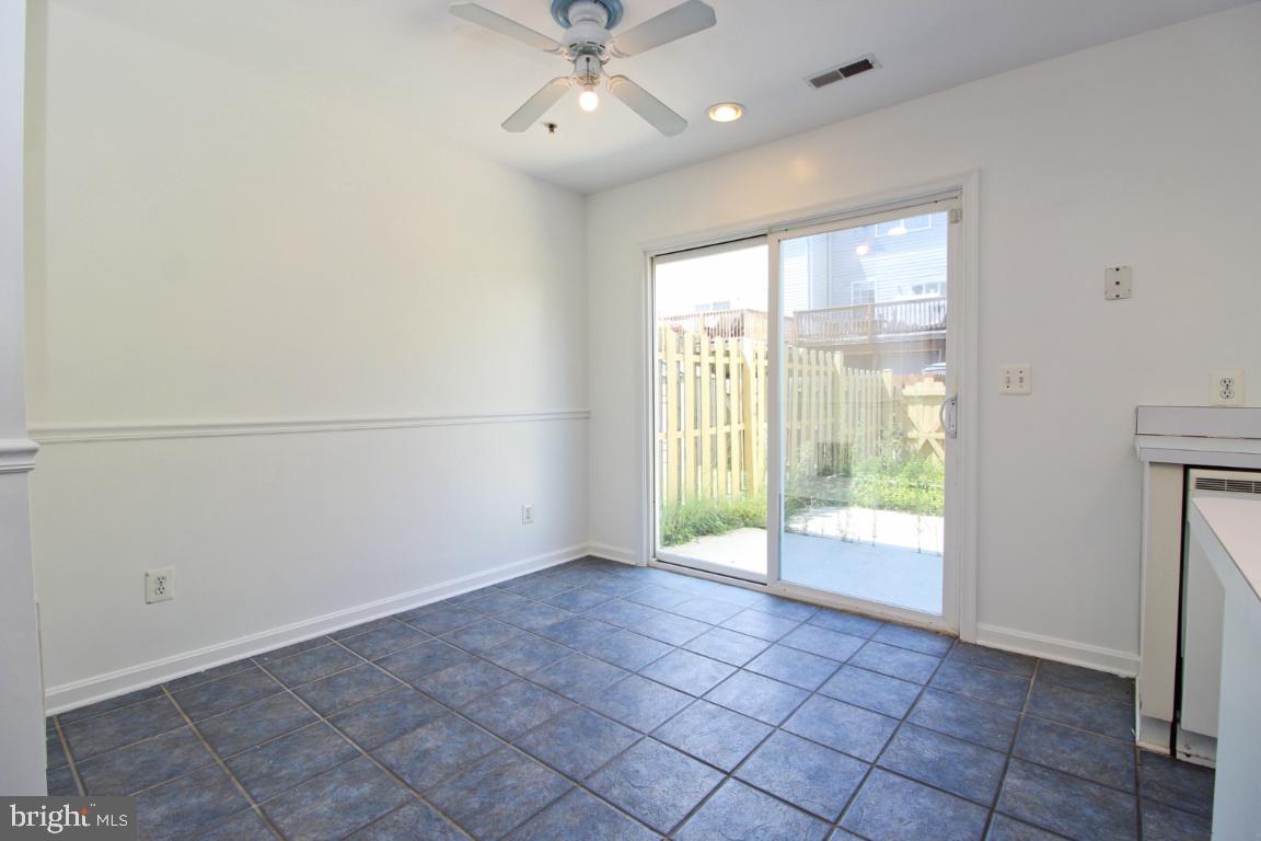 656 Luthardt Road Baltimore, MD 21220 - Photo 8 of 27 a view of an empty room with a window