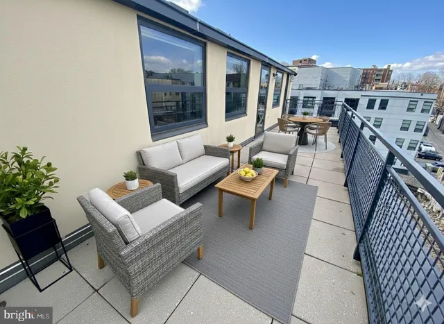 a kitchen with stainless steel appliances kitchen island granite countertop a refrigerator and a stove