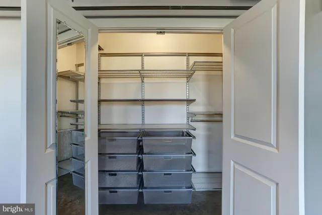 a refrigerator freezer sitting inside of a room