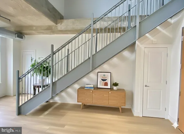a spacious bedroom with a bed next to a window