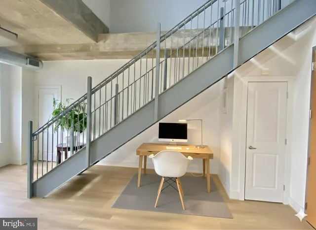 a bedroom with a bed a couch and a table