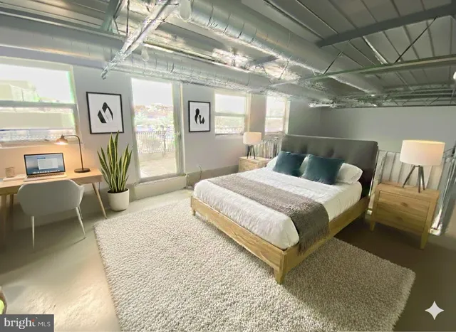 a view of balcony with seating space and wooden floor