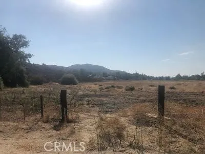 a view of an ocean beach and mountain