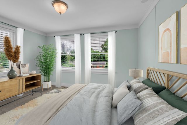 a bedroom with a bed and a couch