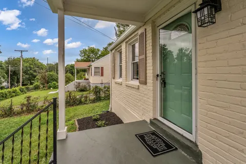 a view of a two chairs in the balcony