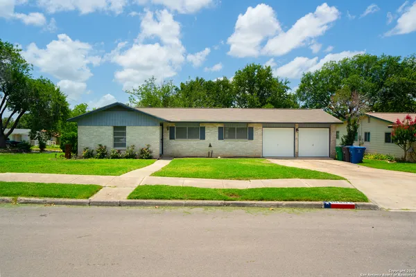 a view of front a house with a yard