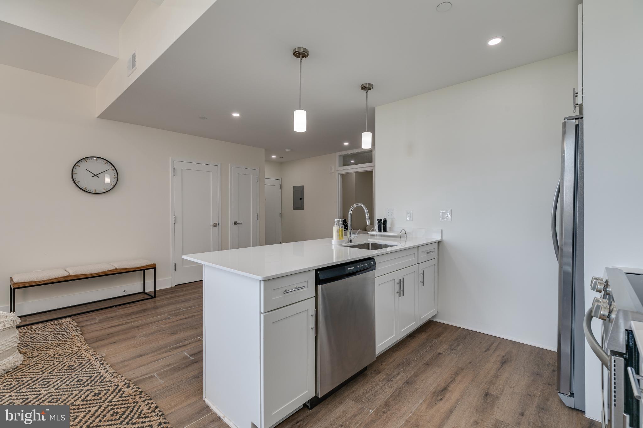 150 South Independence Mall West, Unit 403 Philadelphia, PA 19106 - Photo 11 of 19 a kitchen with a sink stainless steel appliances and cabinets