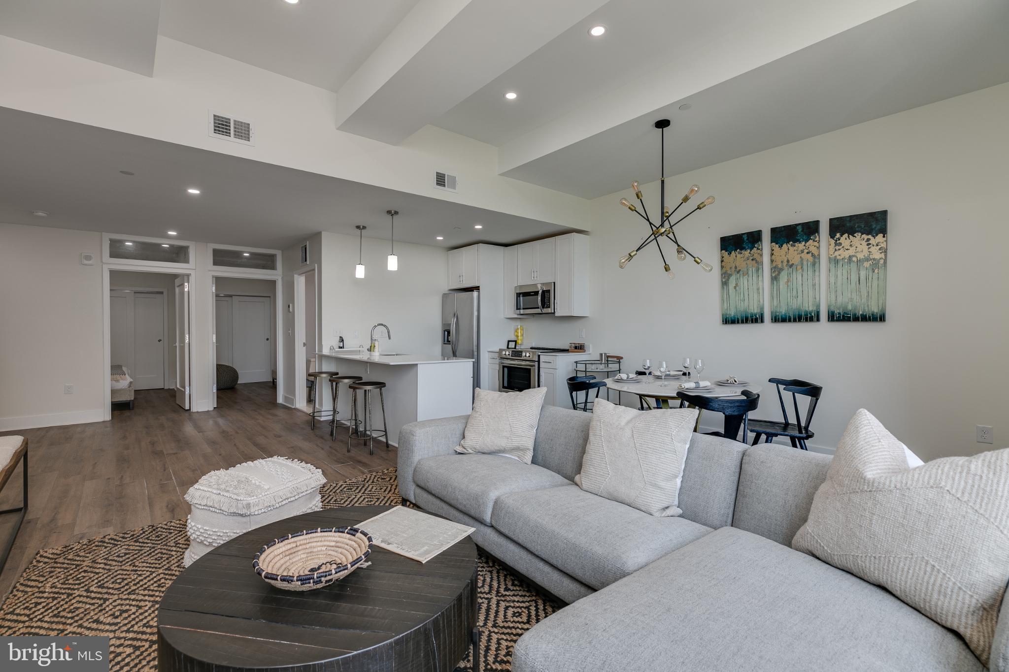 150 South Independence Mall West, Unit 403 Philadelphia, PA 19106 - Photo 18 of 19 a living room with furniture and kitchen view