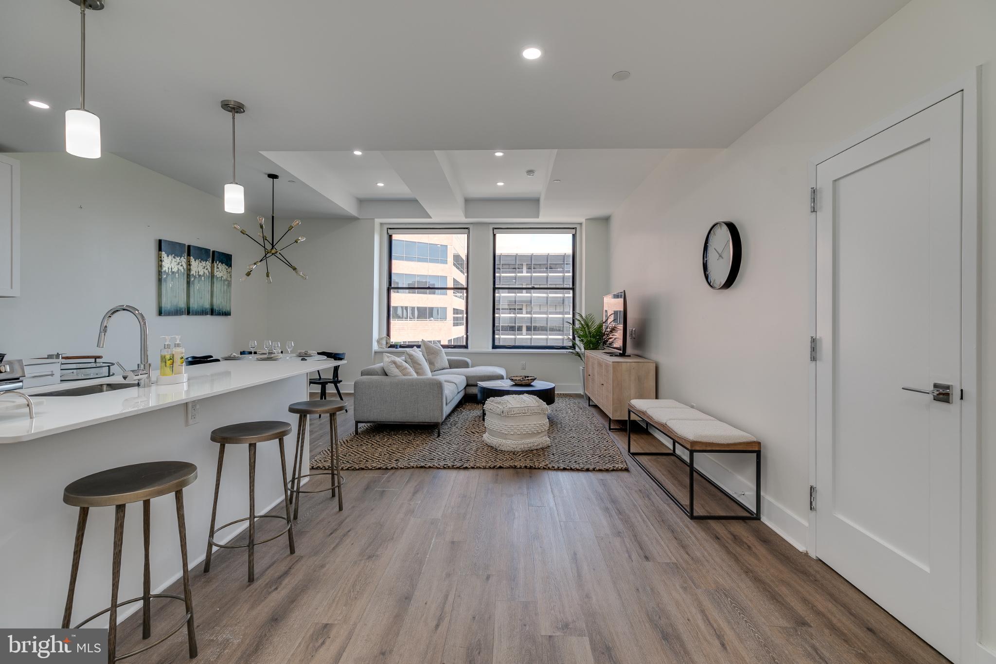 150 South Independence Mall West, Unit 403 Philadelphia, PA 19106 - Photo 4 of 19 a living room with furniture a window and wooden floor