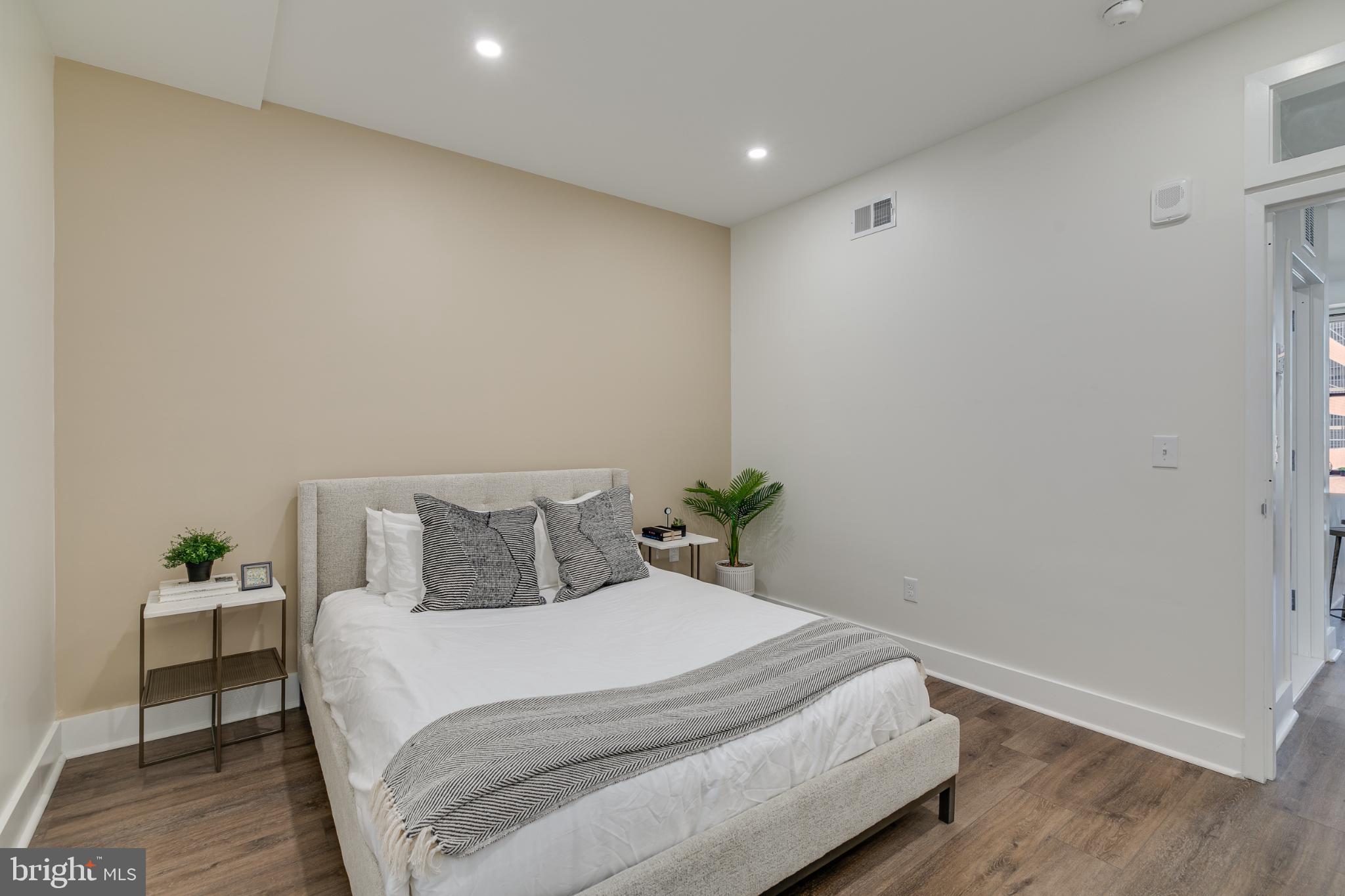 150 South Independence Mall West, Unit 403 Philadelphia, PA 19106 - Photo 5 of 19 a bedroom with a bed and wooden floor