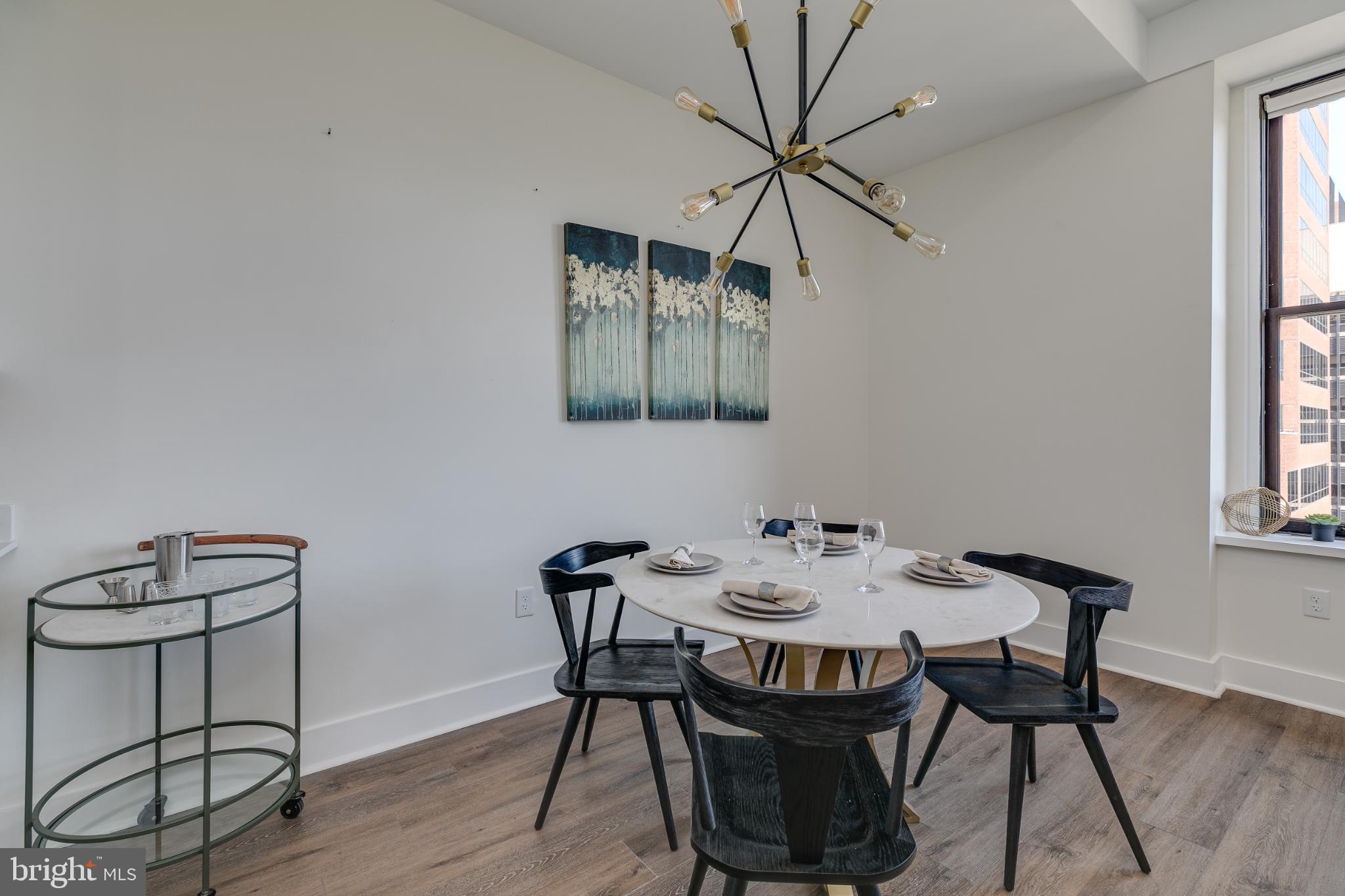 150 South Independence Mall West, Unit 403 Philadelphia, PA 19106 - Photo 9 of 19 a view of a dining room with furniture and wooden floor