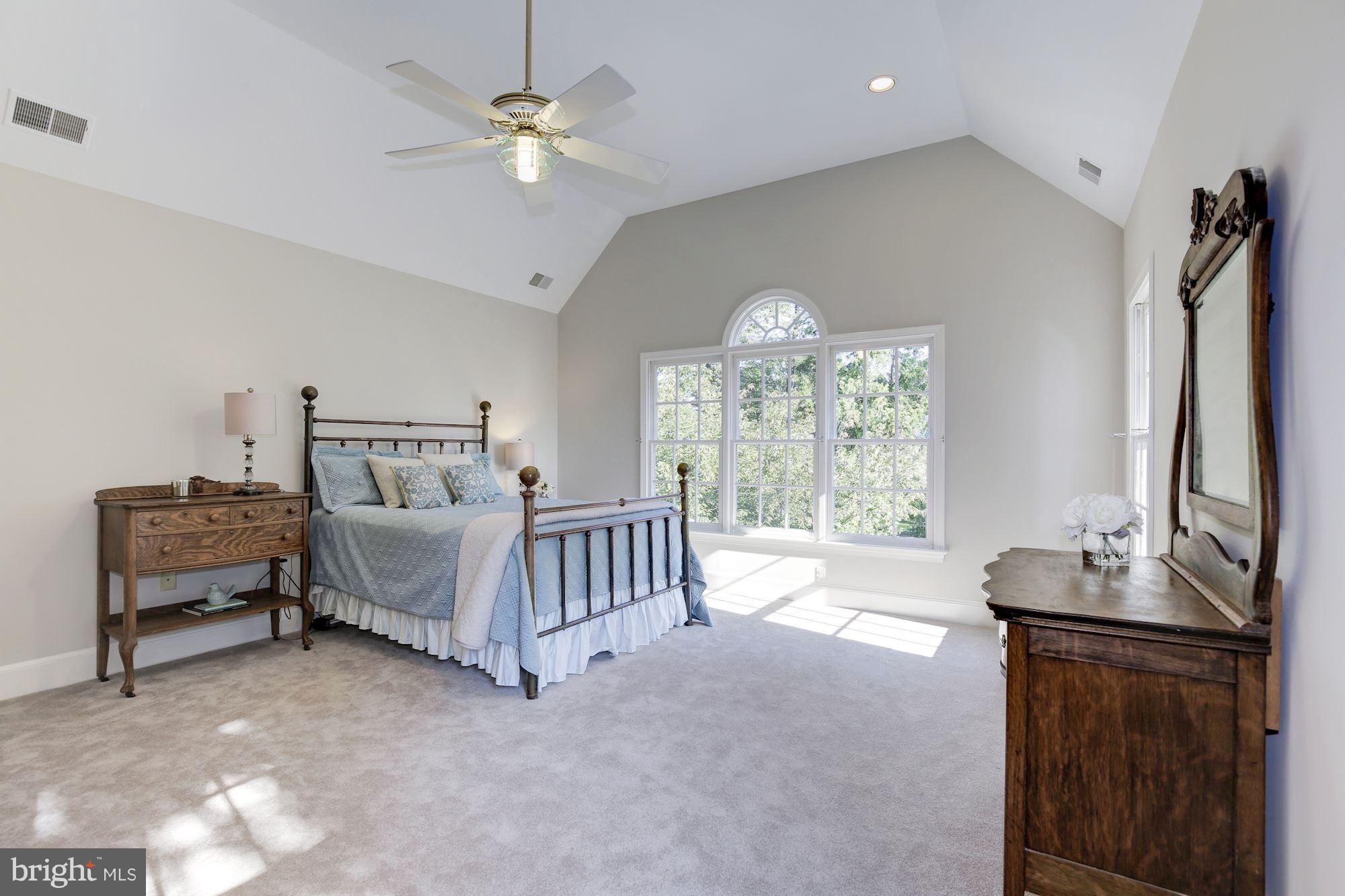 4105 Everett Street Kensington, MD 20895 - Photo 17 of 30 a bed room with furniture and a chandelier