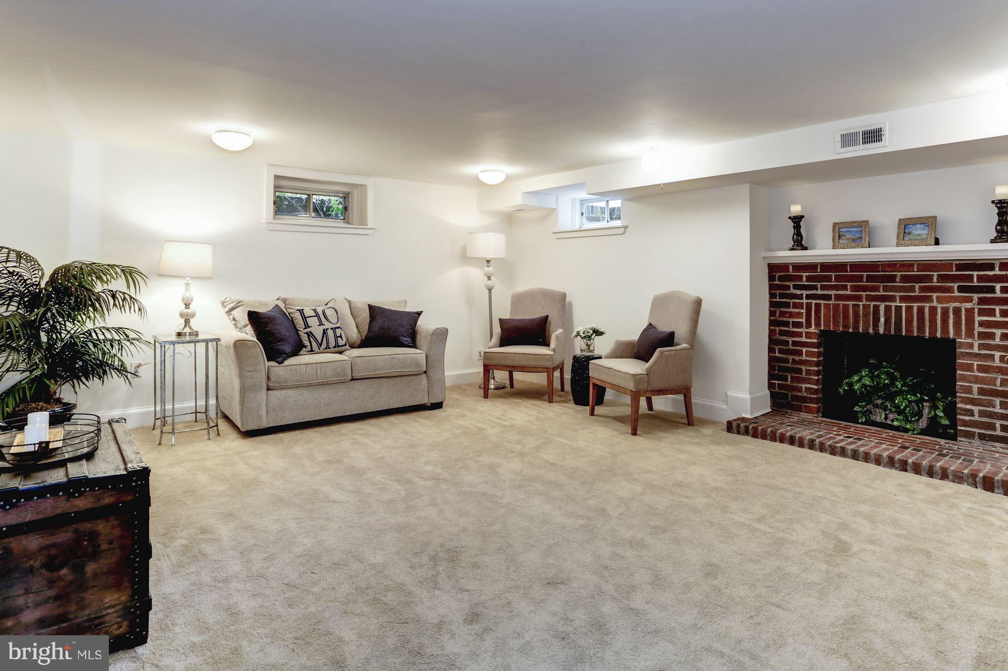 4105 Everett Street Kensington, MD 20895 - Photo 22 of 30 a living room with furniture and a fireplace
