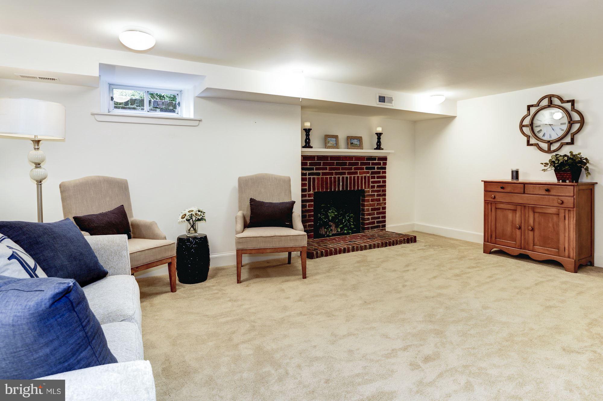 4105 Everett Street Kensington, MD 20895 - Photo 23 of 30 a living room with furniture and a fireplace