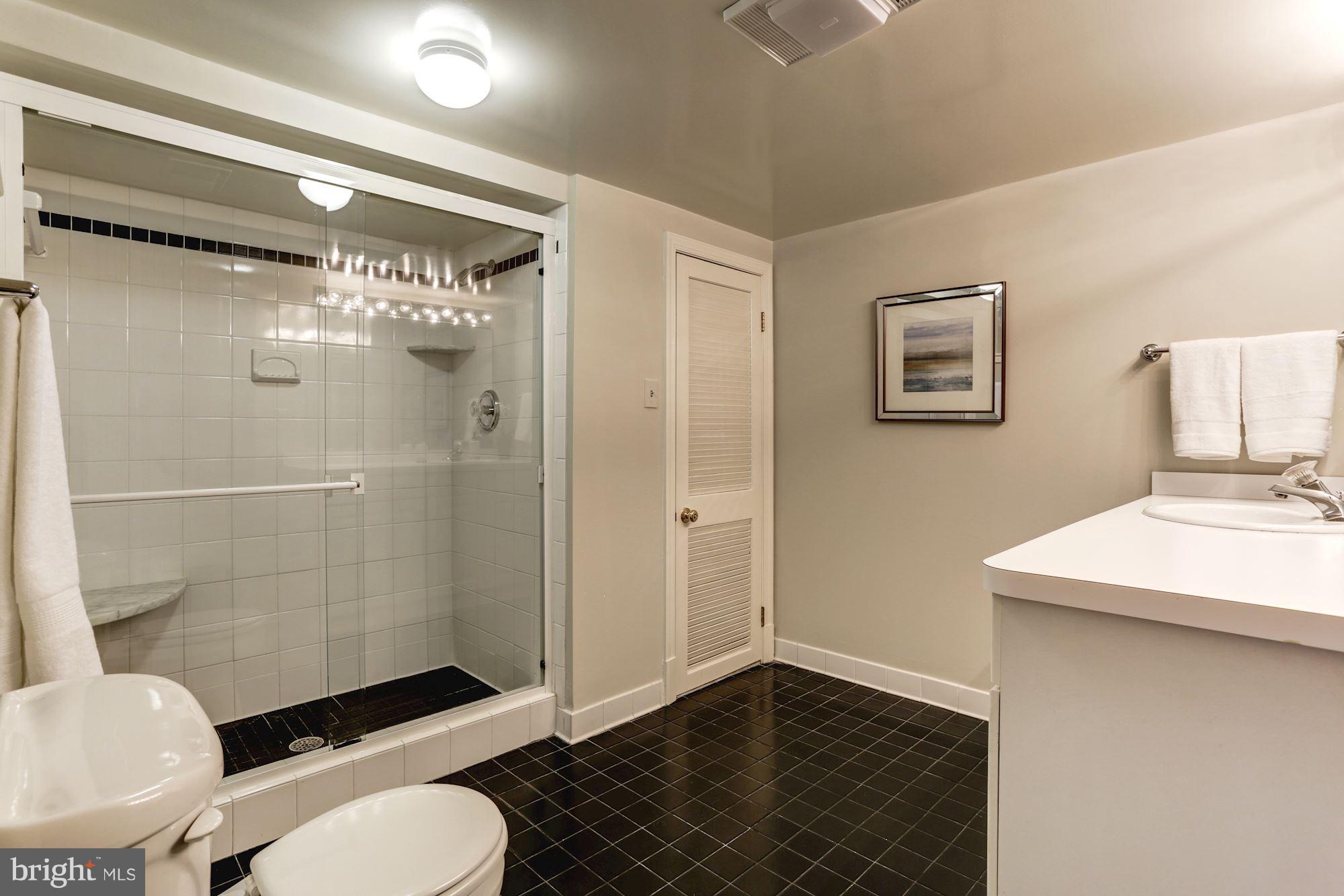 4105 Everett Street Kensington, MD 20895 - Photo 25 of 30 a bathroom with a toilet a sink and shower