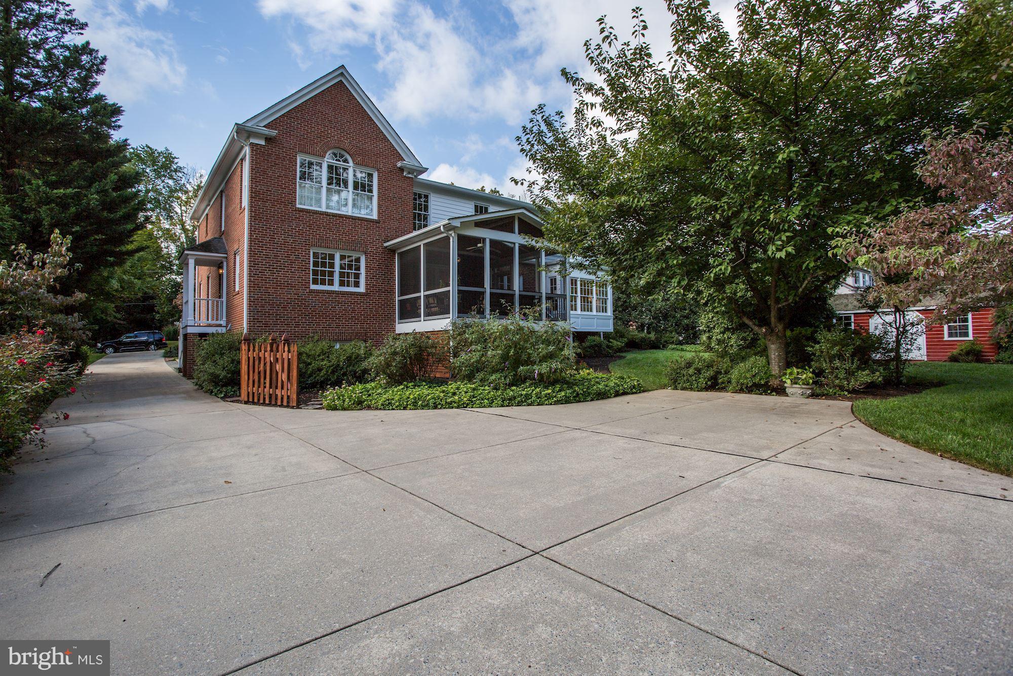 4105 Everett Street Kensington, MD 20895 - Photo 27 of 30 a front view of a house with a yard and trees