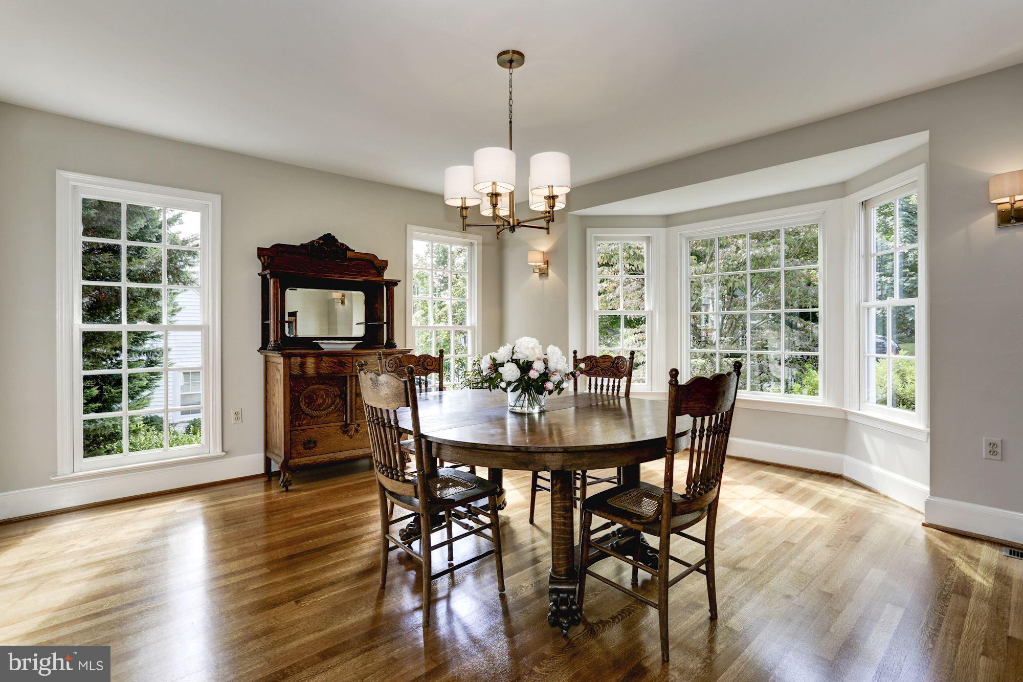 4105 Everett Street Kensington, MD 20895 - Photo 8 of 30 a view of a dining room with furniture window and wooden floor