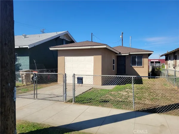 a front view of a house with garage