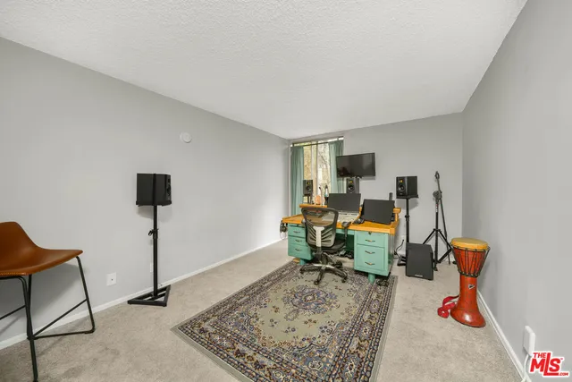 a view of a workspace with furniture