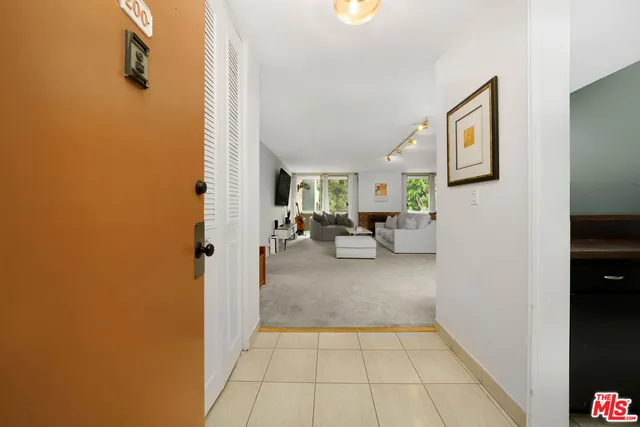 a view of hallway with livingroom and hallway