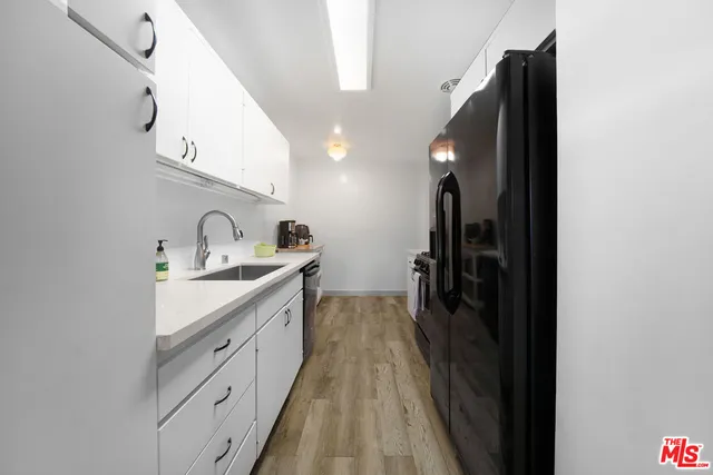 a spacious bathroom with a sink and a mirror