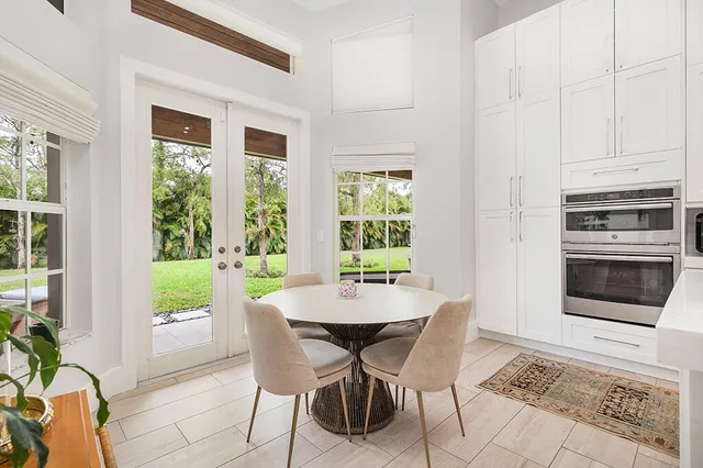 a view of a dining room with furniture window and outside view