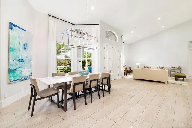 a view of a dining room with furniture and window
