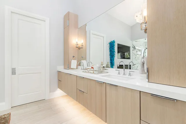 a bathroom with a double vanity sink and a mirror