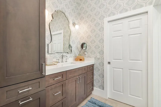 a bathroom with a sink and a mirror
