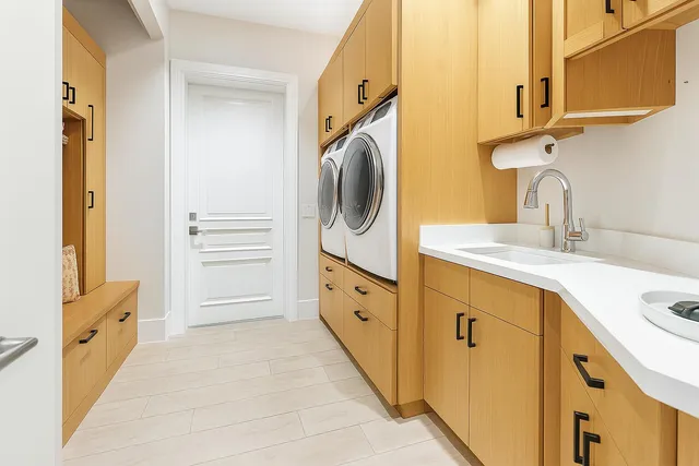 a bathroom with granite countertop a sink a mirror and a bathtub