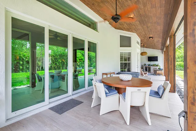 a dining room with a table and chairs