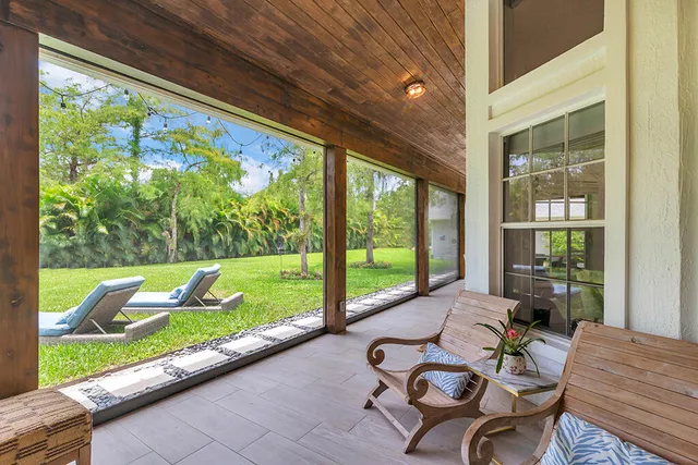 a view of swimming pool with seating area