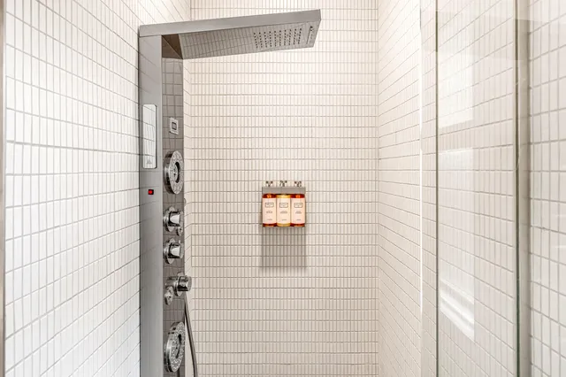 a kitchen with stainless steel appliances a stove a sink and a refrigerator