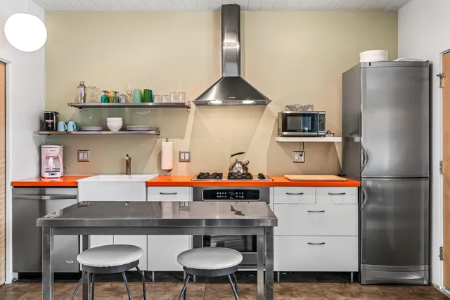 a living room with blue lights furniture and a large window