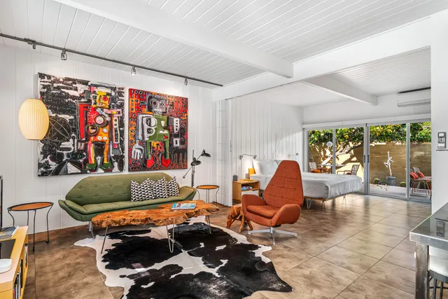 a living room with furniture and a chair