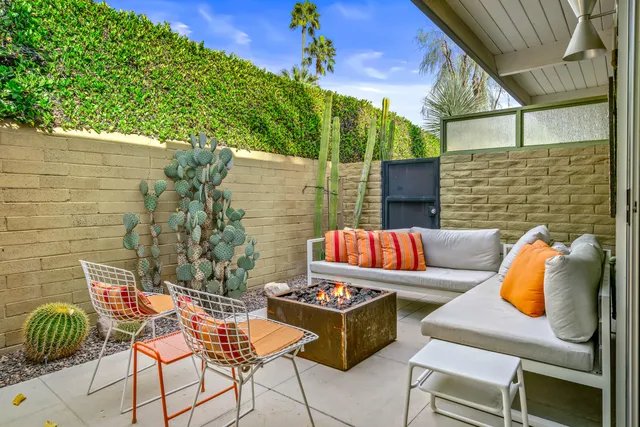 a view of a chairs and table in the patio