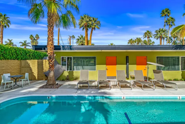 a view of a room next to a small yard