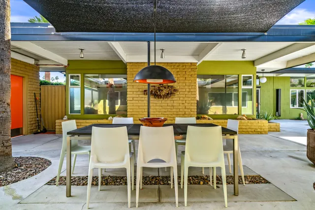 a front view of a house with a lake view