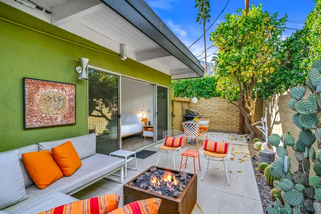 a outdoor living space with furniture and a potted plant