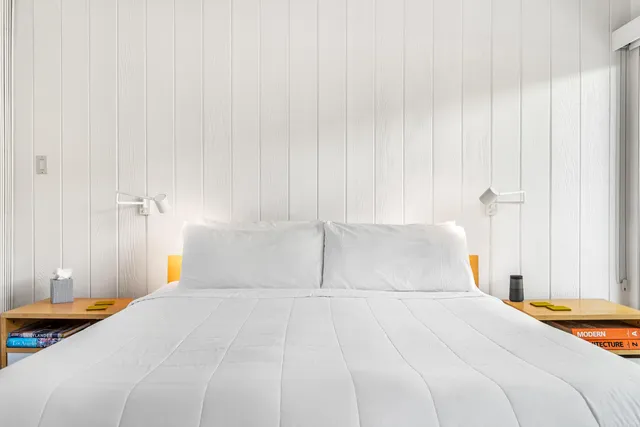 a bedroom with a bed and a closet