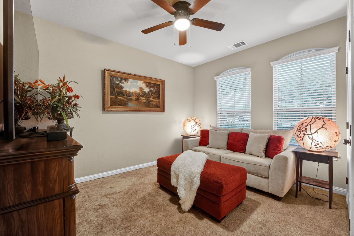 4521 Pyrenees Pass Bee Cave, TX 78738 - Photo 18 of 22 a living room with furniture and a window